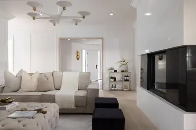 a living room with a couch and a flat screen tv at Vineyard Estate by the River with Pool in Niagara on the Lake