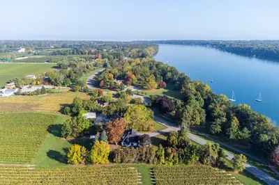 an aerial view of a large estate next to the water at Vineyard Estate by the River with Pool in Niagara on the Lake