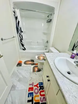 a bathroom with a sink and a toilet and a tub at Sky Cove - Modern Comfort, Simple, Cozy, Central in Saint Thomas