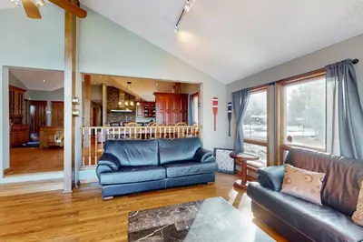 a living room with a couch and a table at Main House in Wasaga Beach