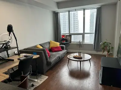 a living room with a couch and a table at Entire Place With Pool Sauna in Vaughan