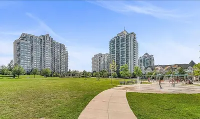 a park with tall buildings in a city at Entire Place With Pool Sauna in Vaughan