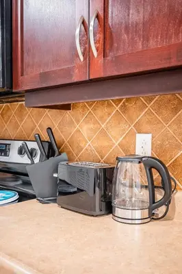 a toaster on a counter in a kitchen at Basement Suite for 2 w Private Patio in Toronto in Toronto