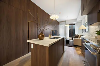 a kitchen with a vase on top of a counter at The Brick Hotel - The Second Suite in Toronto