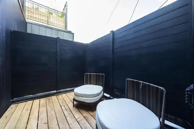 a balcony with two toilets on a wooden deck at The Brick Hotel - The Second Suite in Toronto