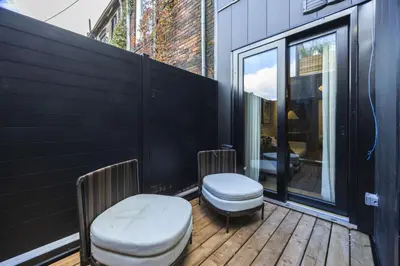 a balcony with two toilets on a wooden deck at The Brick Hotel - The Second Suite in Toronto