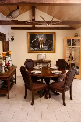a dining room with a wooden table and chairs at Luxury Forest Retreat Near Mansfield Ski Club in Mulmur