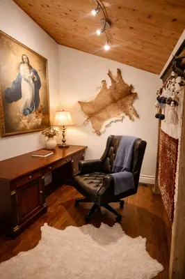 a office with a chair and a desk and a painting at Luxury Forest Retreat Near Mansfield Ski Club in Mulmur