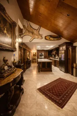 a large kitchen with a wooden ceiling and a table at Luxury Forest Retreat Near Mansfield Ski Club in Mulmur