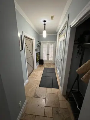 a hallway with a door and a tile floor at Nature & Comfort - Private Manor in Innisfil