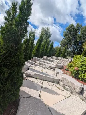 a set of stone steps in a garden at Nature & Comfort - Private Manor in Innisfil