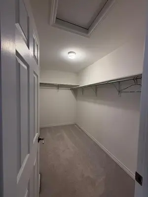 an empty room with a door and a room with a ceiling at Short Term Cozy Stay in Beautiful Fergus in Fergus