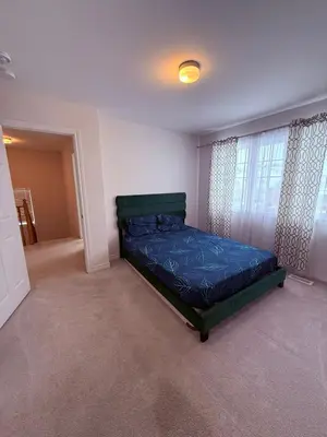 a bedroom with a bed in a room with a window at Short Term Cozy Stay in Beautiful Fergus in Fergus