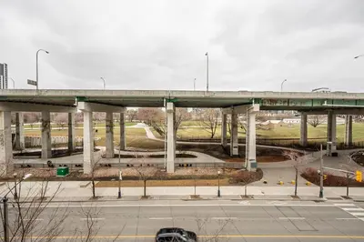 a bridge over a road with a highway at Modern 1Bedroom Condo with Balcony Downtown Toronto in Toronto