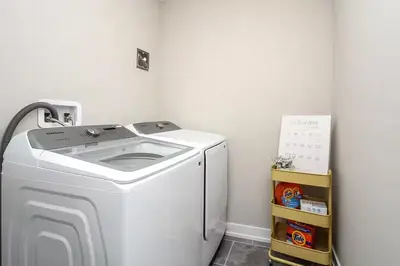 a white washer and dryer in a room at Peak Perfection at The Blue Mountains in Blue Mountains