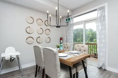 a dining room with a table and chairs at Peak Perfection at The Blue Mountains in Blue Mountains