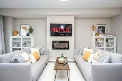 a living room with two couches and a tv at Peak Perfection at The Blue Mountains in Blue Mountains