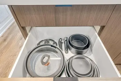 a group of pots and pans in a drawer at Your Friday Harbour Escape Awaits! in Innisfil