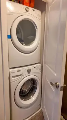 a washer and dryer in a small room at 17 Zorra street in Toronto