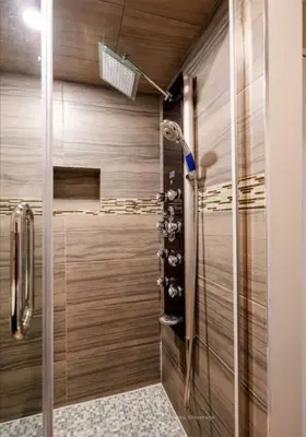 a walk in shower with wooden walls and a glass door at Home Base Executive Rental in Hamilton in Hamilton