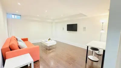 a white living room with a couch and a table at Newly Renovated Private Suite Separate Entrance in Richmond Hill