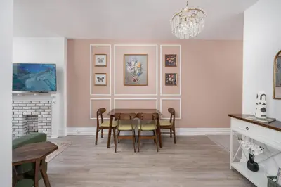 a dining room with a table and chairs at Vintage Charm on Roncesvalles in Toronto