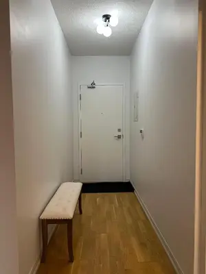 an empty room with a bench and a door at Brightly Lit Suite Centrally Located |UofT|Ryerson in Toronto