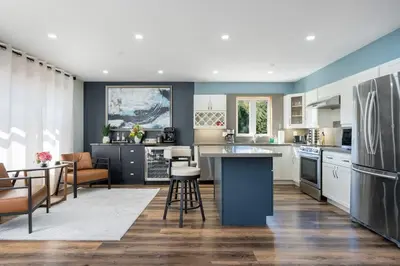 a kitchen and living room with a table and chairs at Large Chalet Hideaway - Hottub-SwimSpa - Sauna in Blue Mountains