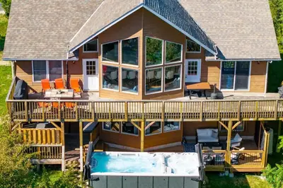 an aerial view of a house with a deck and a pool at Large Chalet Hideaway - Hottub-SwimSpa - Sauna in Blue Mountains