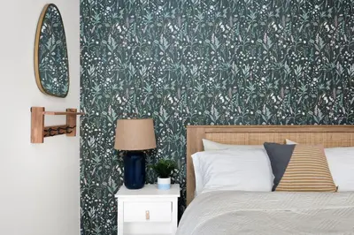 a bedroom with a bed with a green and white wallpaper at Sauna Hot Tub Lake Off-Grid AFrame Retreat in Gravenhurst