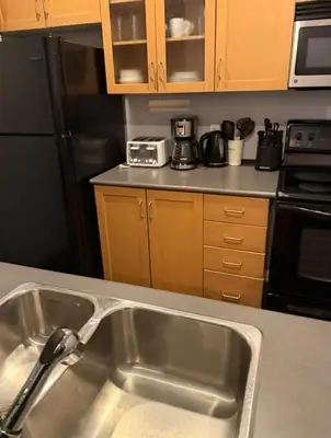 a kitchen sink with a faucet in a kitchen at apartment for 4 guests in Port Hope