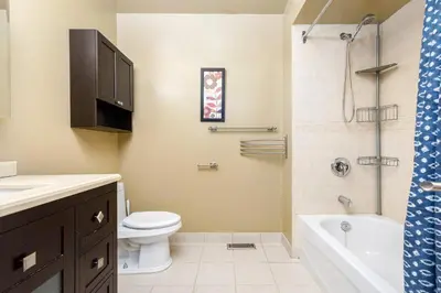 a bathroom with a toilet and a sink and a shower at House with 5 Beds for Families in Great Location in Mississauga