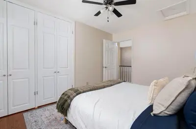 a bedroom with a bed and a ceiling fan at House with 5 Beds for Families in Great Location in Mississauga