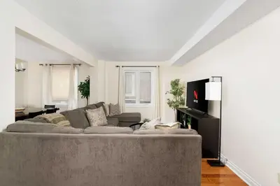 a living room with a large couch in a room at House with 5 Beds for Families in Great Location in Mississauga