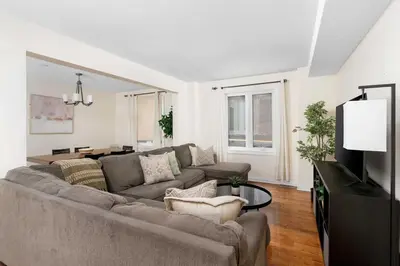 a living room with a couch and a tv at House with 5 Beds for Families in Great Location in Mississauga