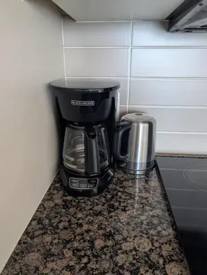 a coffee maker sitting on a counter in a corner at Nice Place Central to Downtown in St. Catharines