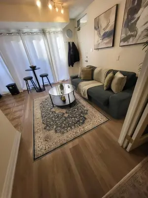 a living room with a couch and a coffee table at Small Apartment for 2 in St. Catharines