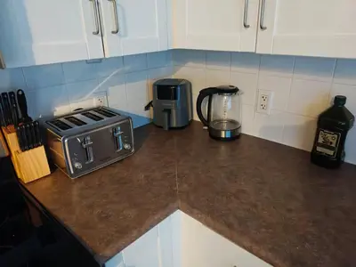 a kitchen counter with a toaster and a blender on it at Small Apartment for 2 in St. Catharines