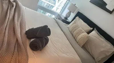 a stuffed animal sitting on top of a bed at Sleep 2 guests cozy couch in Port Hope