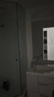 a bathroom with a sink and a mirror at Modern Group Condo in Port Hope