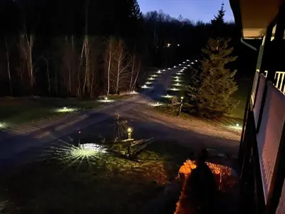 a street at night with a christmas tree and lights at Cajun Cabin Private Nature Resort in Minden