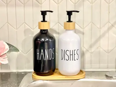 two bottles on a wooden holder with words on them at Violet Escape Modern Apt 1B 1B, Kitchen, Parking in Richmond Hill