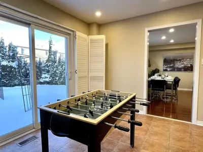 a large game room with a foos ball at Paris Charm Modern 4B3B, Kitchen, Parking,5G in Richmond Hill