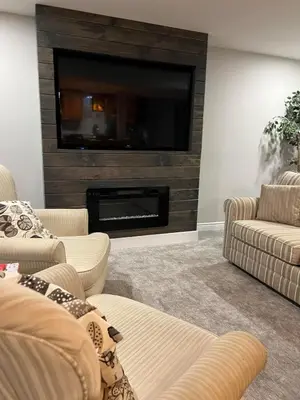 a living room with two couches and a fireplace at Deluxe Country Escape-Entire Basement Unit in Hamilton