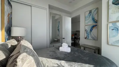 a bedroom with a bed with a towel on it at Prestige Upper Series 1-Bedroom Condo at Vaughan Metropolitan Centre in Vaughan