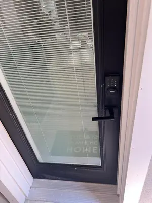 a black door with a window with blinds on it at Luxury 2 Bedroom 2Bathroom Modern B Apartment in Ajax, Toronto in Ajax
