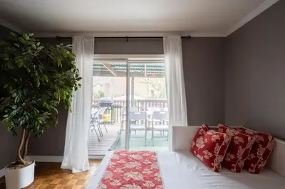 a bedroom with a bed and a sliding glass door at Spacious Bright Home In Woodbridge in Vaughan