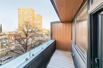 a balcony with a view of a city at Westend Suites - Bright & Inviting 3BR Hotel near High Park in Toronto
