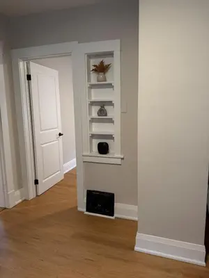 an empty room with a door and a shelf at The Maple and Mist in Niagara Falls