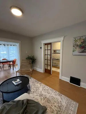 a living room with a couch and a table at The Maple and Mist in Niagara Falls